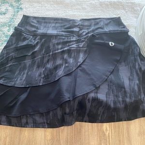 Donajo Tennis/golf skirt. Camo with black ruffle detail. Size 2